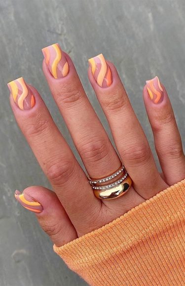 The Prettiest Summer Nail Designs We've Saved : Orange swirl nails