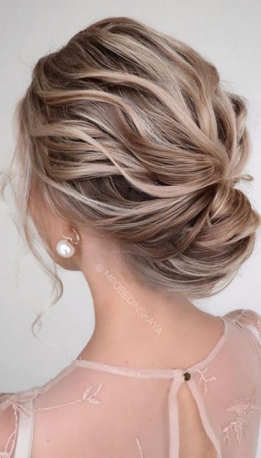 Sophisticated updos for any occasion – Textured volume low bun for ...