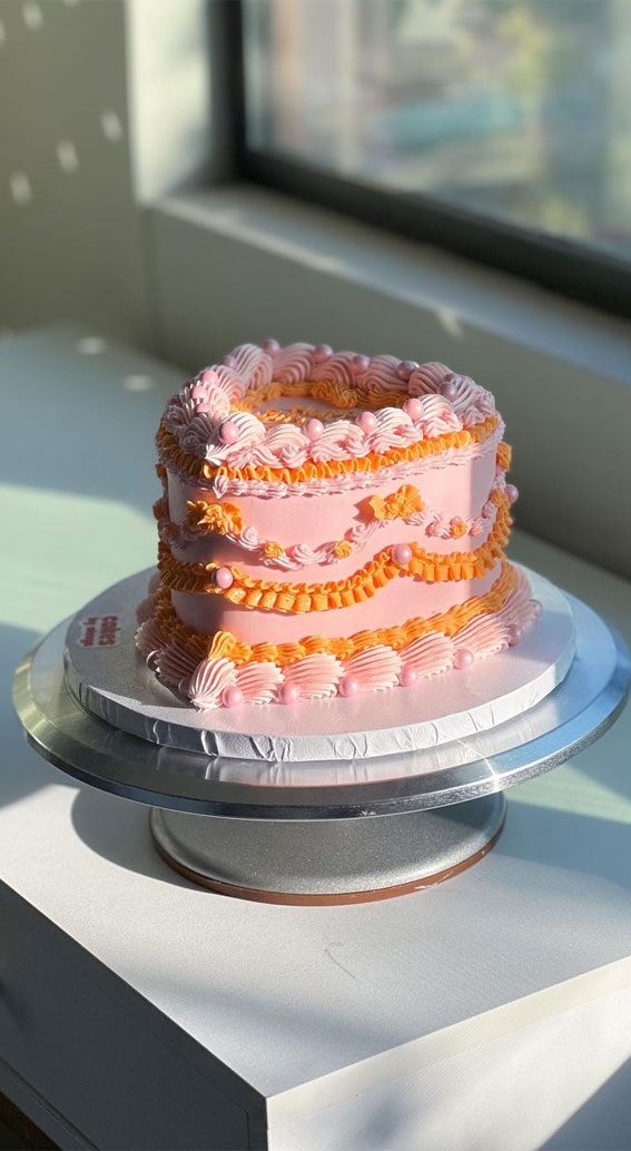 Pink and Orange Birthday Cake Decorated with Macaroons, Meringues, Donuts,  Waffle Cones, Cake Pops and Chocolate Bars. Stock Photo - Image of  celebrate, frosted: 179945552