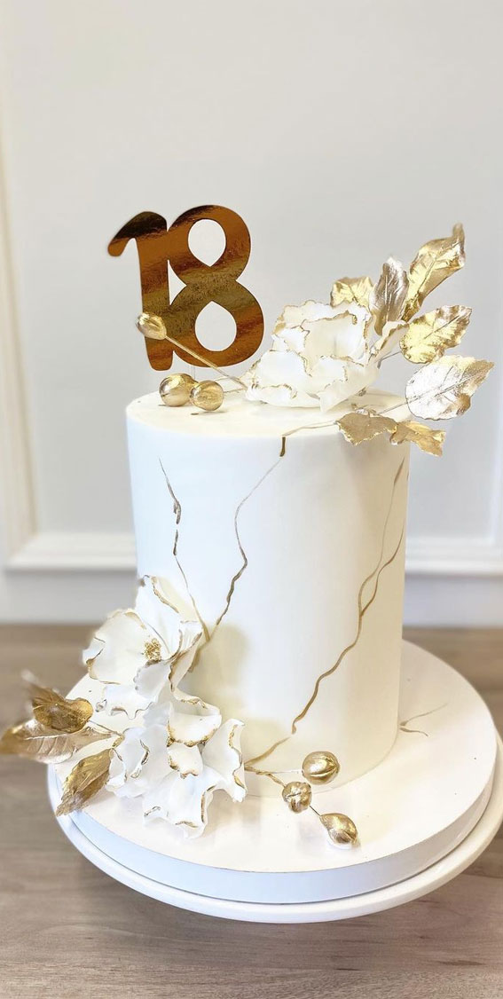White Wedding Cake Decorated With Gold Flowers On A White Background Stock  Photo - Download Image Now - iStock
