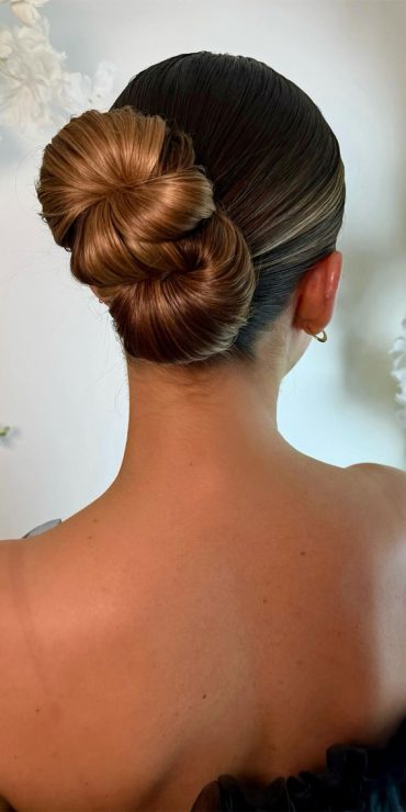 35 Creative Hairdos for Every Occasion : Clean Bow Bun with a Twist