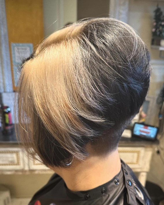 undercut stacked bob for older women, stacked bob with undercut for women over 60, stacked bob haircut with blonde highlights