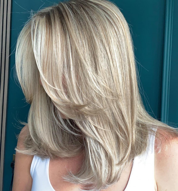 Blonde Balayage Midi Length Haircut with Curtain Bangs