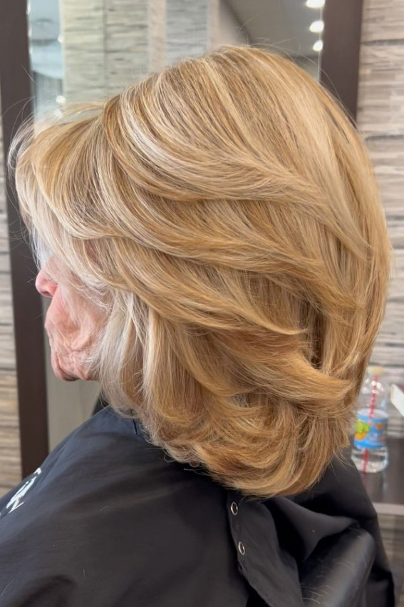 medium-layered haircut for women over 60, blonde layered haircut, bob layered haircut, trendy medium-length haircut, soft layered haircut