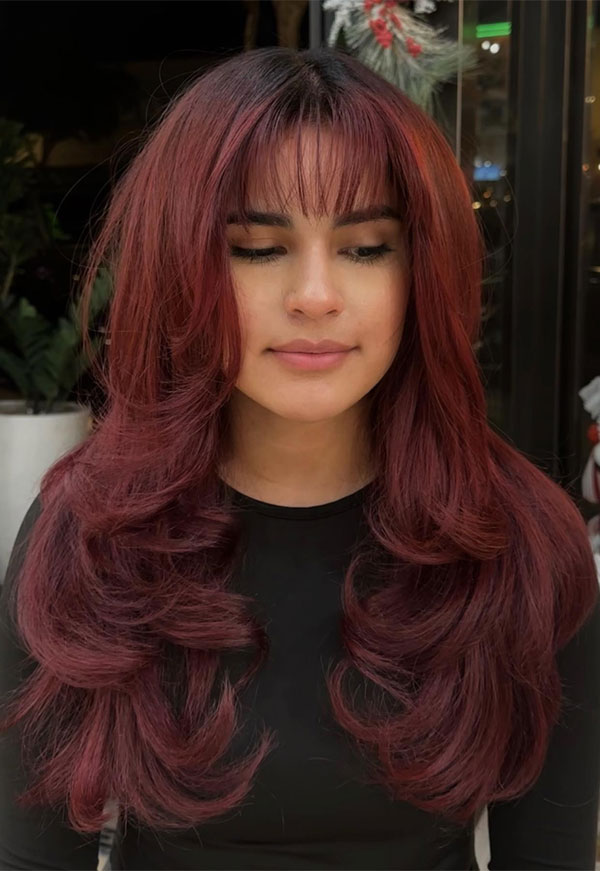 30 Radiant Red Hair Shades for Autumn : Burgundy Layers with Wispy Bangs