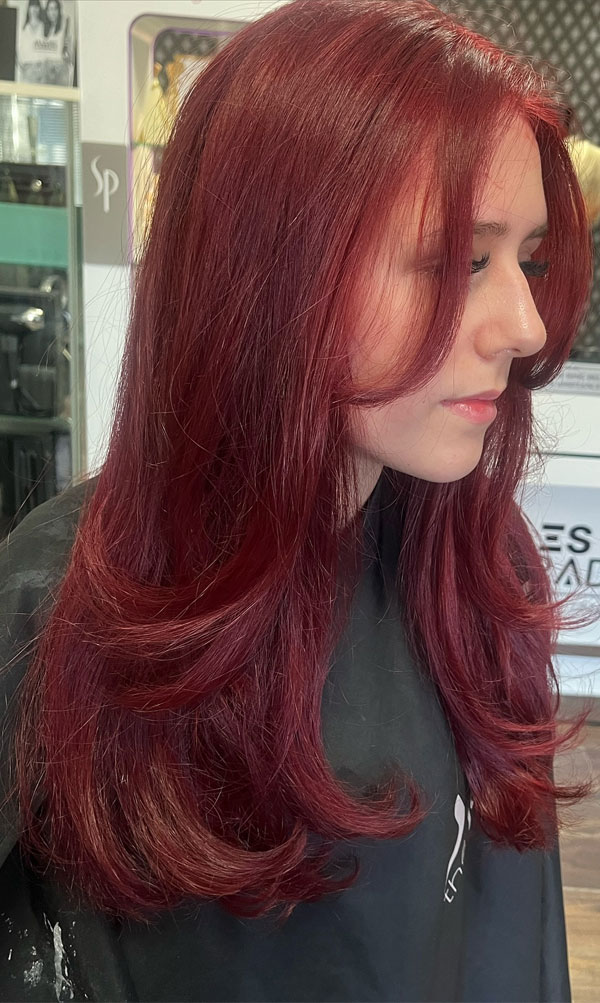 30 Radiant Red Hair Shades for Autumn : Deep Burgundy Long Layers with Curtain Bangs