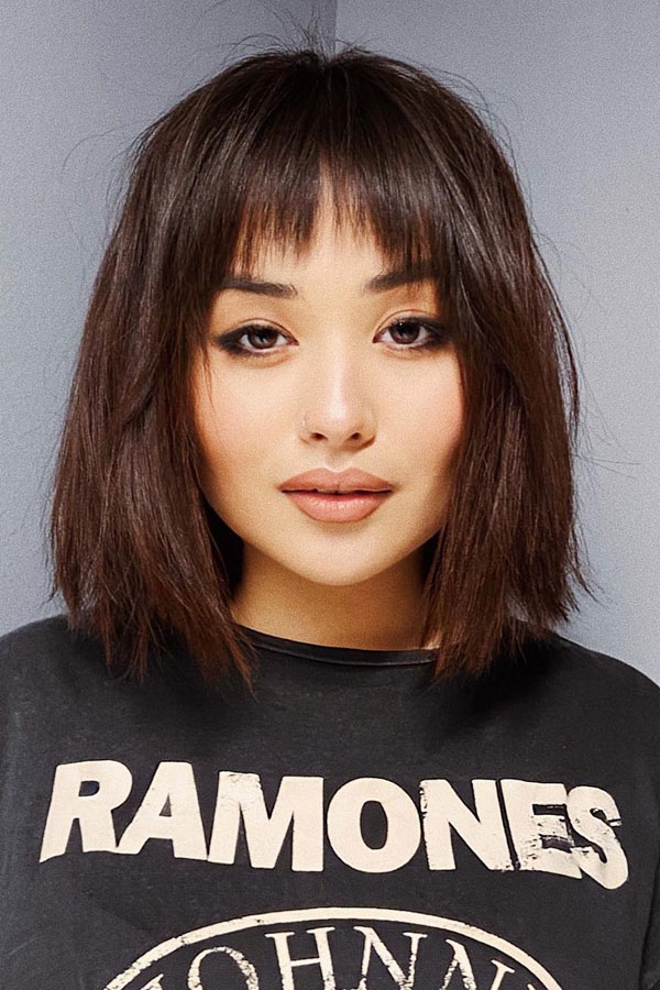 50 Chic Shoulder-Length Haircuts with Bangs : Effortless Edgy Bob with Wispy Bangs