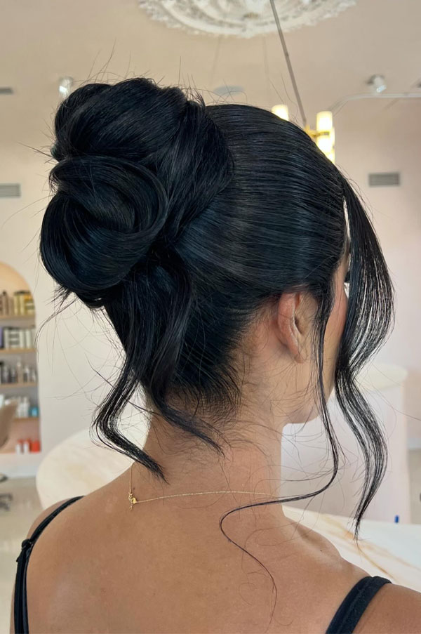 25 Stunning Updo Hairstyles for Every Occasion : Elegant Twisted High Bun