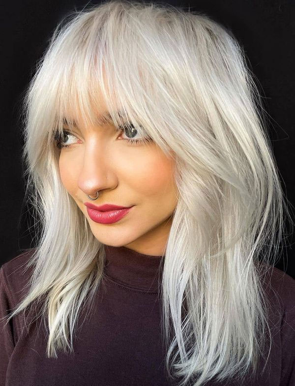 50 Chic Shoulder-Length Haircuts with Bangs : Icy Blonde Shaggy Layers with Bangs