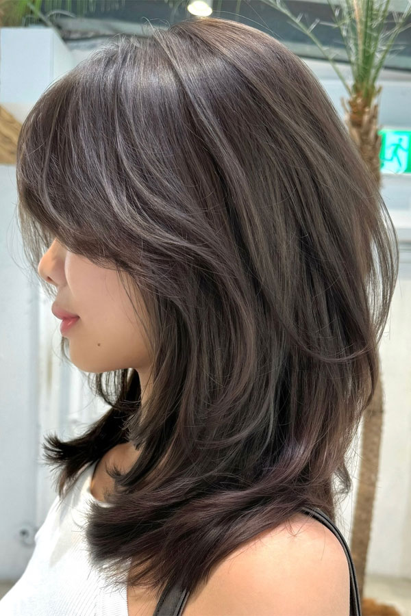 Voluminous Layered Haircut with Curtain Bangs