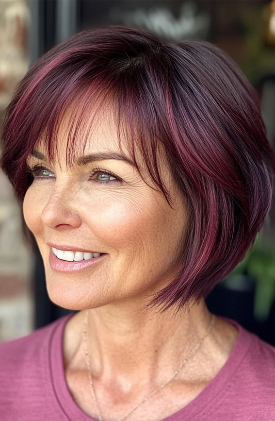 47 Bob Hairstyles for Women Over 50 : Bold Berry-Toned Bob with Wispy Fringe