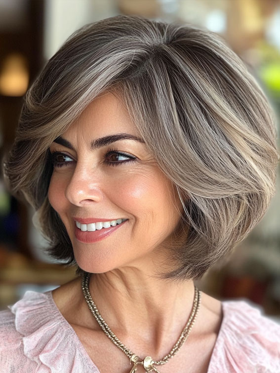 40 Layered Bob Hairstyles for Women Over 50 : Ashy and Silver Feathered Layered Bob