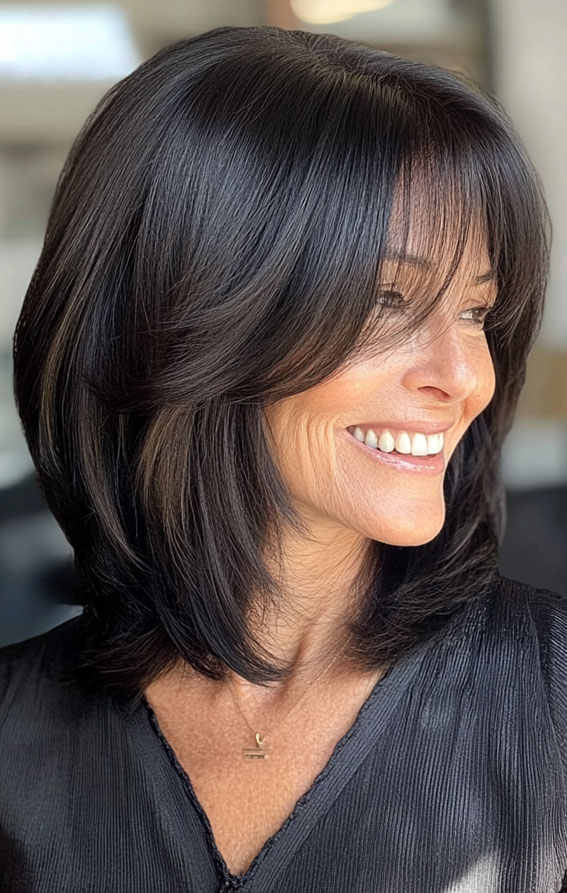 40 Layered Bob Hairstyles for Women Over 50 : Black Bob with Long Layers and Wispy Fringe