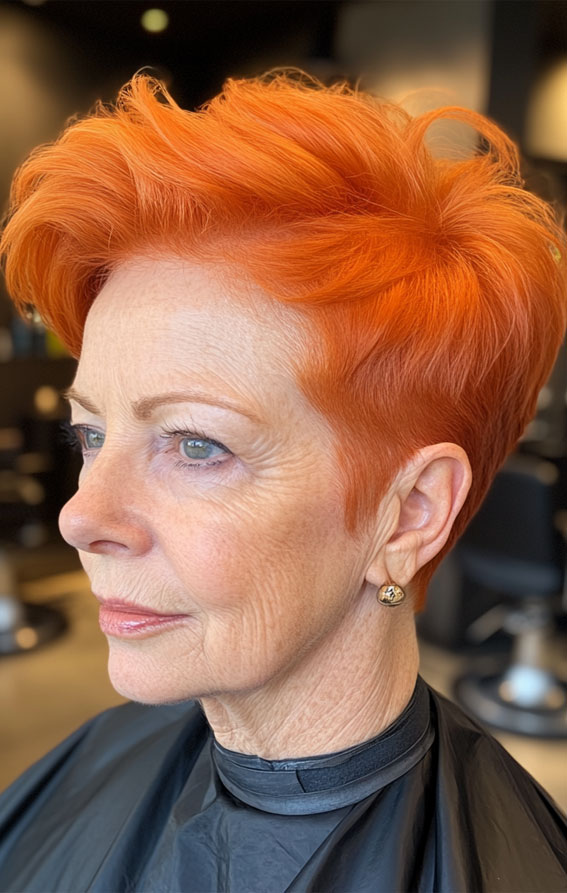 Vibrant Orange Pixie with Bold Volume, Pixie Haircuts for Women Over 60, Layered pixie haircuts for Women over 60, Low maintenance pixie haircuts for women over 60, Wash and Wear Haircuts For Women Over 60, Pixie cuts for over 60 with glasses, Choppy pixie cut for over 60, Pixie hairstyles for women over 60, Long pixie haircuts for women over 60, short haircuts for women over 60