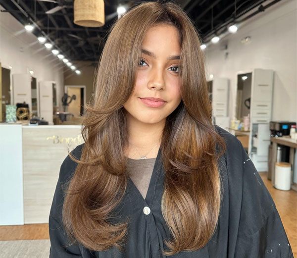 Soft Honey Brown Layers with Long Curtain Bangs