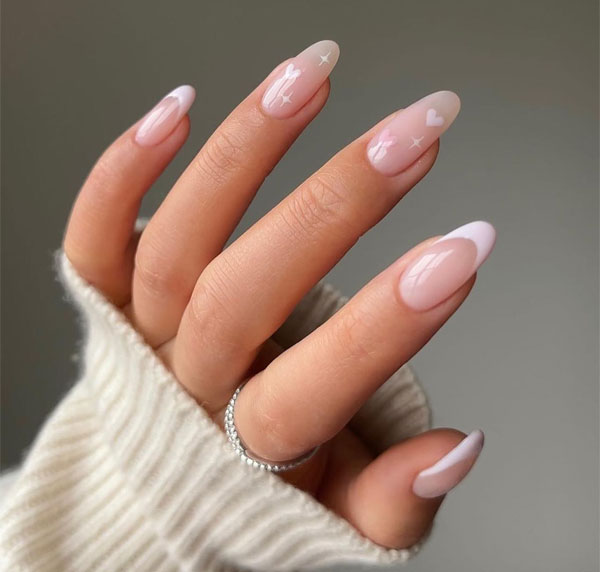 20 Minimalist Valentine’s Day Nail Designs : Sheer Pink Almond Nails with White Heart and Star Accents