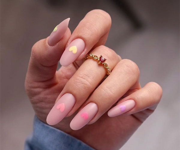 20 Minimalist Valentine’s Day Nail Designs : Pastel Hearts on Matte Nude Almond Nails