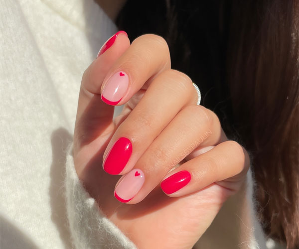 20 Minimalist Valentine’s Day Nail Designs : Bold Red French Tips with Heart Accents