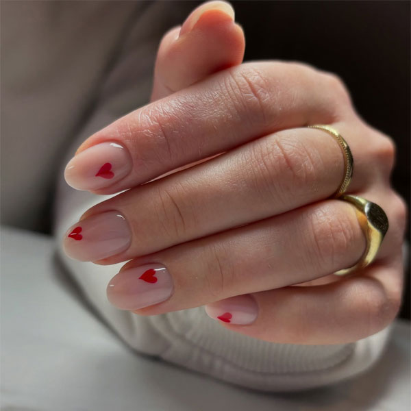 20 Minimalist Valentine’s Day Nail Designs : Sheer Nude Nails with Simple Red Hearts