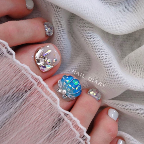 Milky White Oceanic Elegant Toenail Design, cute toe nail art, cute toe nail designs, summer toe nails, trendy toe nails, elegant pedicure designs, seashell-inspired pedicure designs