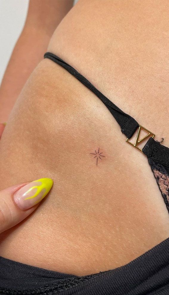 MInimalist lotus flower tattoo on the hip