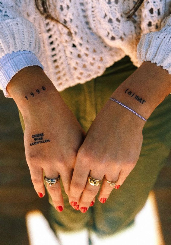word tattoos on side of hand