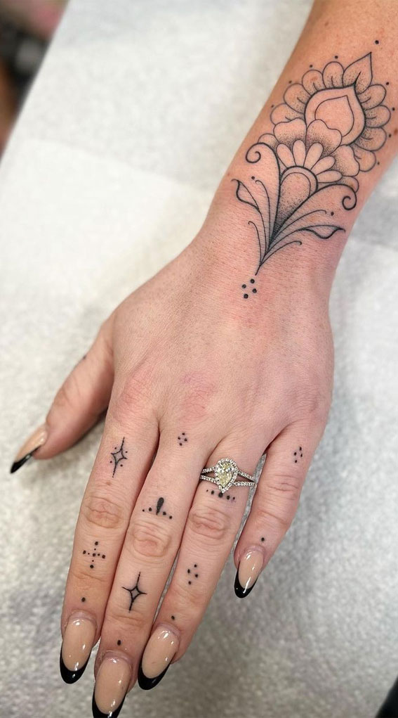 sparkle tattoo on finger