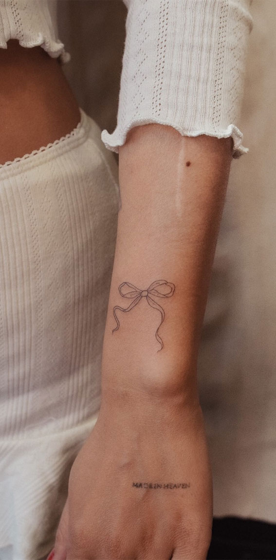 Ink Fusion Where Art and Identity Meet : Cute Bow Tattoo on Arm
