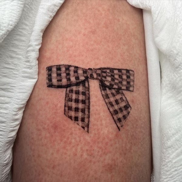 checkered bow tattoo, gingham bow tattoo, arm tattoos, bow tattoo simple, bow tattoo, bow tattoo dainty, archery bow tattoo, bow tattoo meaning, archery bow tattoo meaning, bow tattoo designs