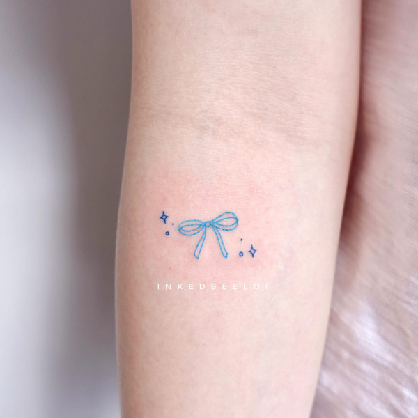small blue bow tattoo, bow tattoo simple, bow tattoo, bow tattoo dainty, archery bow tattoo, bow tattoo meaning, archery bow tattoo meaning, bow tattoo designs