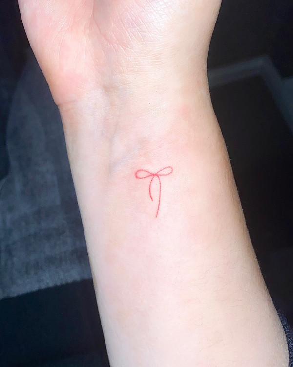 tiny bow tattoo, wrist tattoo ideas, bow trend tattoo