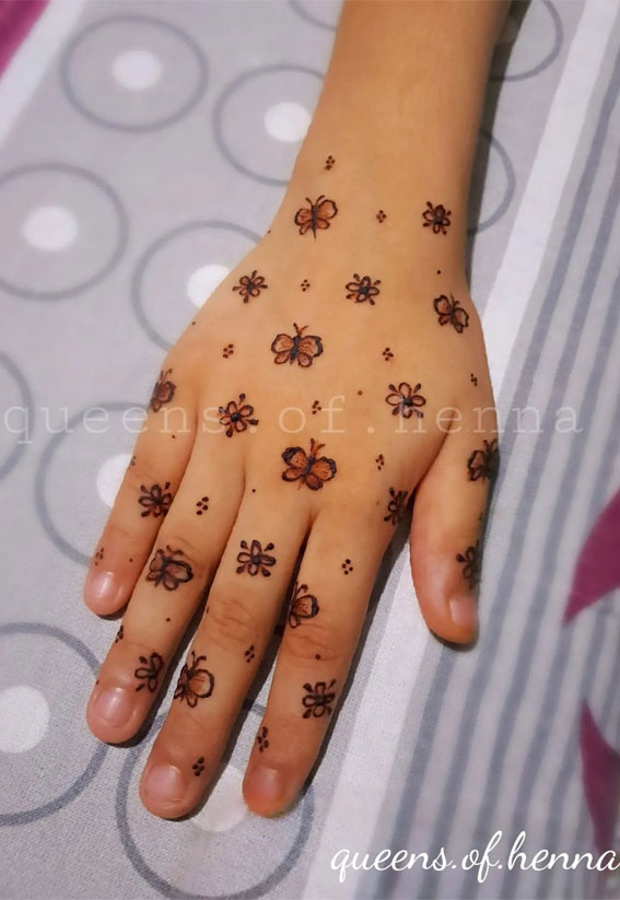 Cute Mix of Small Flower & Butterfly Henna Design on Dorsal Hand