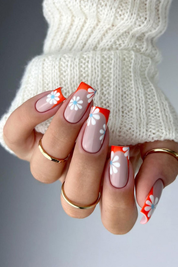 orange french tip nails, flower nails, orange tips with flower accent nails