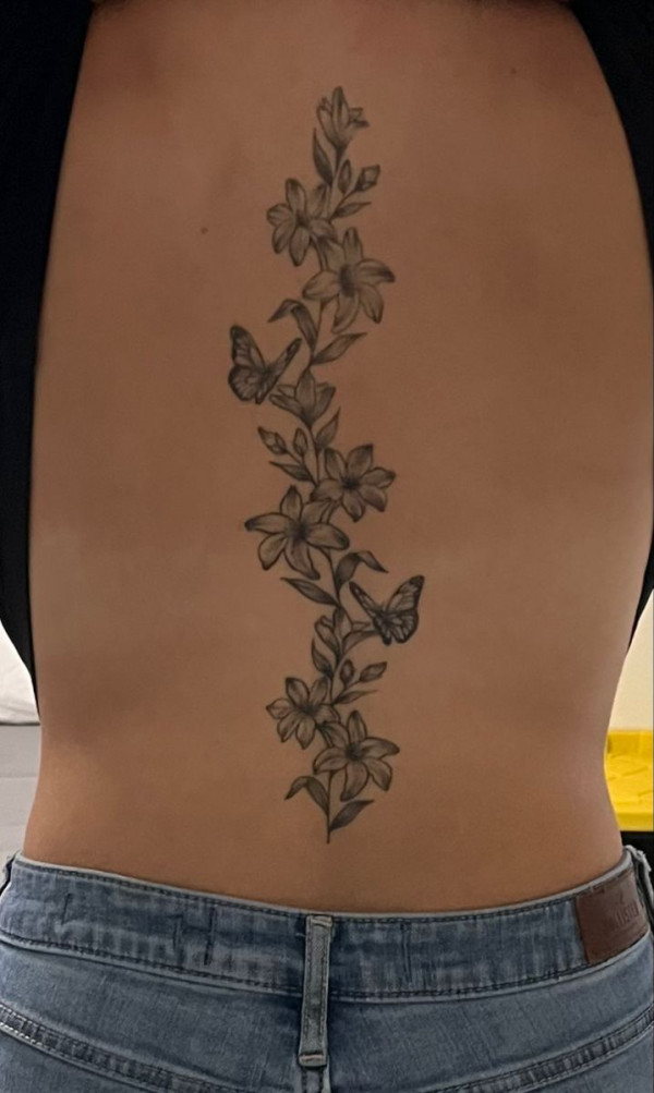 Butterfly & Lily Vine Spine Tattoo : Elegant Tattoo Design