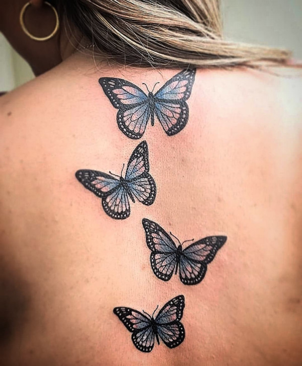 Black and Blue Butterfly Spine Tattoo : Elegant and Striking