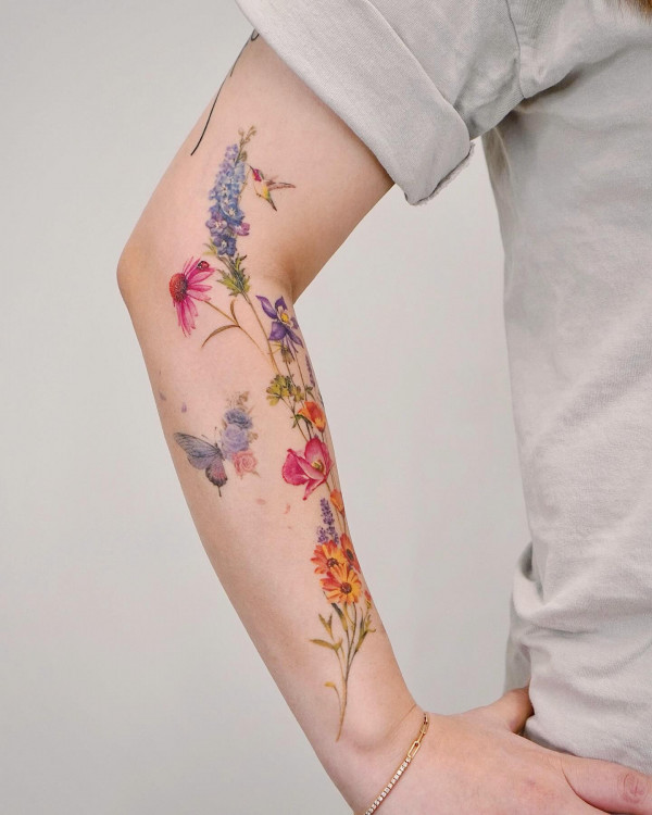 wildflower tattoos, flower tattoo arm women. Flower tattoo arm female, floral arm tattoo, unique flower arm tattoos for females, colourful floral tattoos, Flower tattoo arm forearm