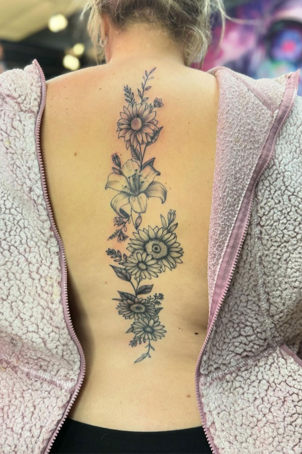 sunflower spine tattoo, lily spine tattoo, birth flower spine tattoos, birth flower tattoo, birth flower spine tattoo, flower spine tattoos