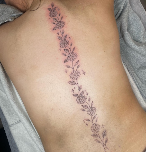 Daisy Spine Tattoo : April Birth Flower Daisy Chain Spine Tattoo