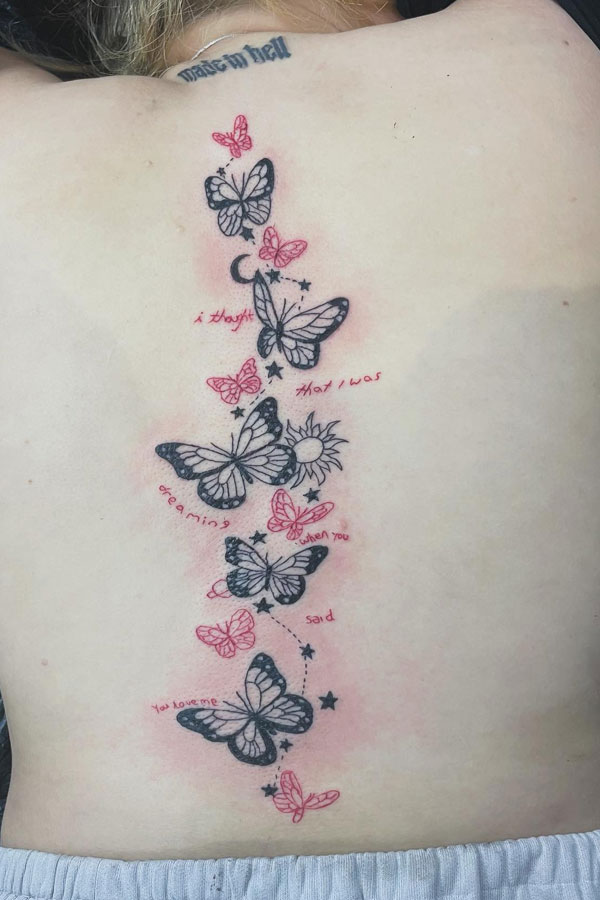 Dreamlike Butterfly Spine Tattoo with Poetic Sentiment