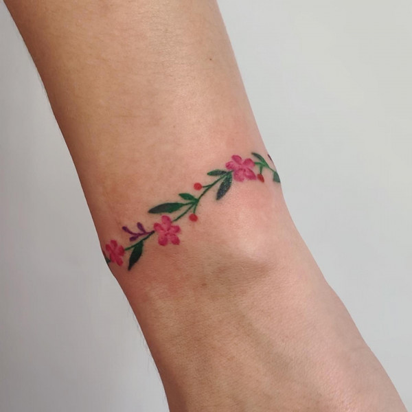 Red Flower Bracelet Tattoo with Berry Accents