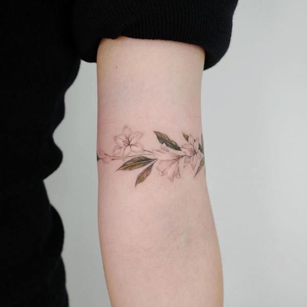 lily arm band tattoo, flower arm band tattoo