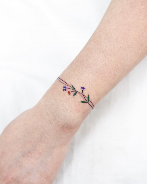Simple Delicate Blue and Red Floral Bracelet Tattoo on Wrist
