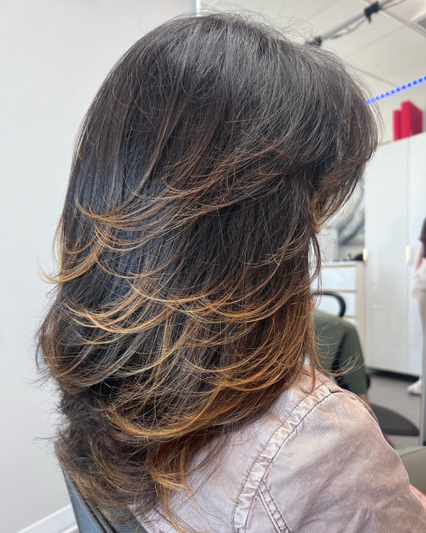 Mid-Back Length Layered Haircut with Ombre Caramel Highlights