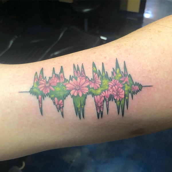 flower tattoo filled soundwave tattoo, Artist tribute tattoos, Soundwave tattoos, Tattoo ideas for music lovers, Music symbol tattoos, Melody tattoos, Rhythm tattoos Harmonic tattoos Musician tattoos