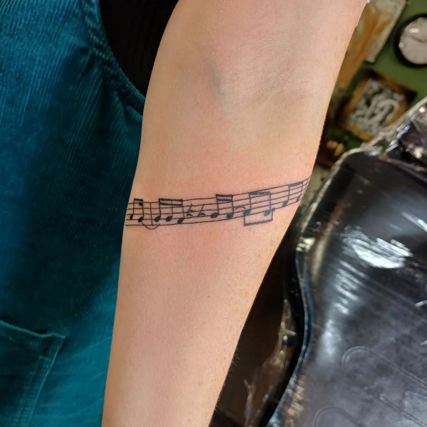 Lyric tattoos, music lover tattoos, music-themed tattoos