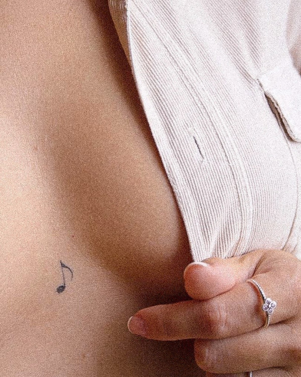 Single Note tattoo on Chest, tiny tattoos