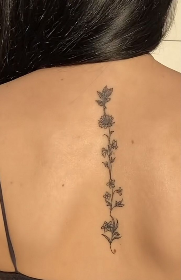 Delicate and Simple Floral Spine Tattoo Elegant in Simplicity