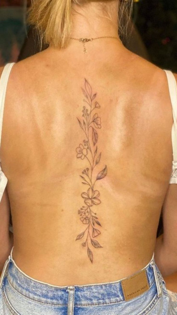 A Simple Floral Vine Spine Tattoo That Exudes Beauty & Elegance