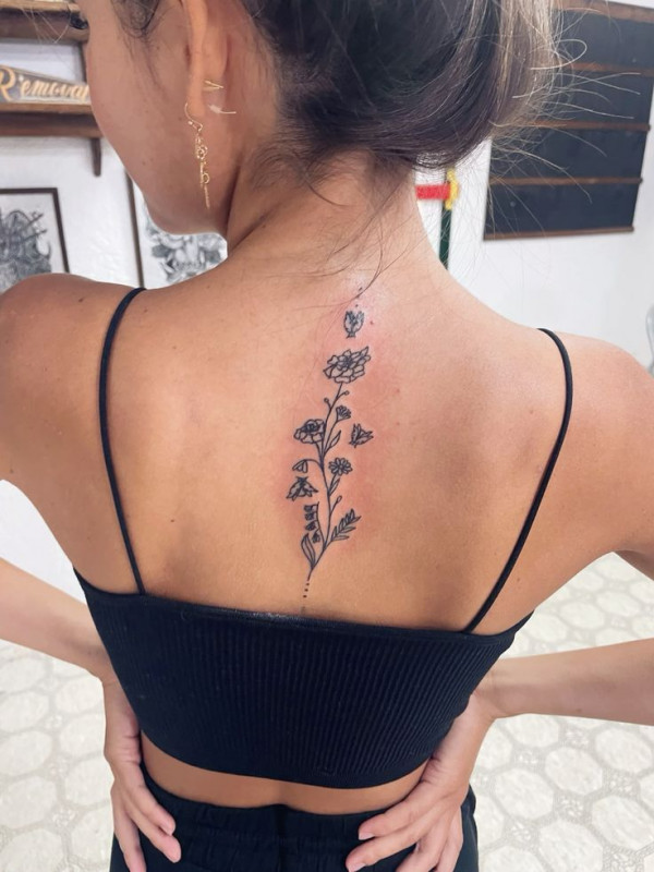 Whimsical & Simple Butterfly and Floral Vine Spine Tattoo