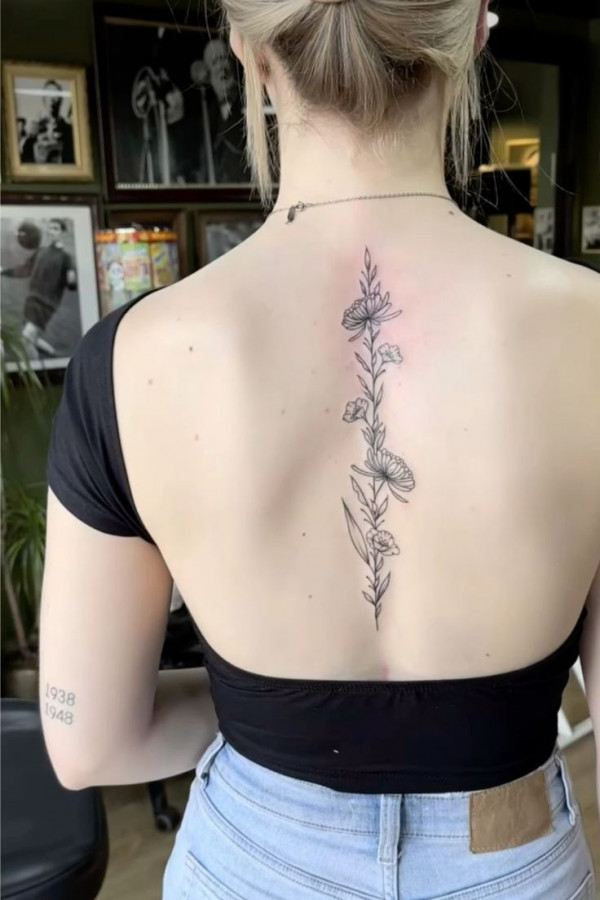 Floral spine tattoo small, flower spine tattoo, Floral spine tattoo female, birth flower spine tattoo, Floral spine tattoo meaning, simple flower spine tattoo, Floral spine tattoo ideas, delicate flower spine tattoo